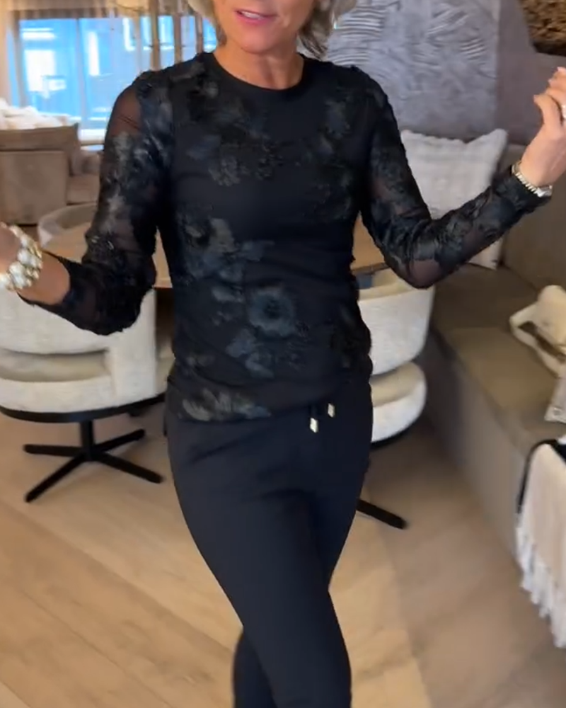 Stilfuld Top Med Rund Hals Og Lange Ærmer