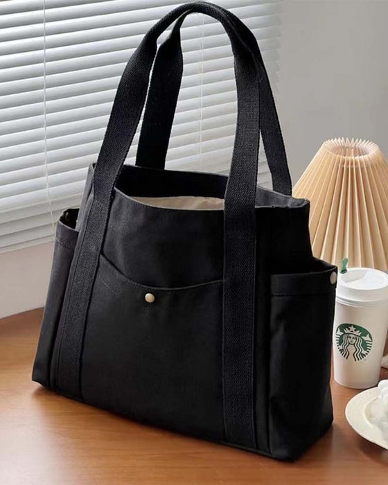 Kanvastaske med dobbelte hanke og stor kapacitet