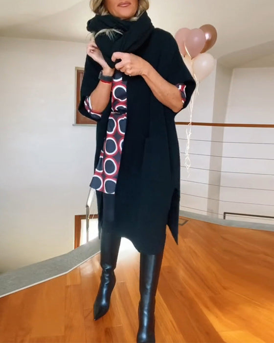 Lang sort cardigan med lommer og halve ærmer