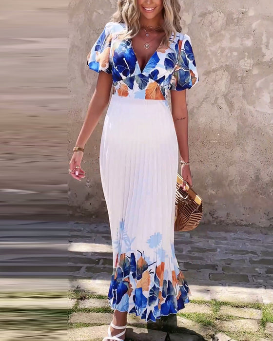 Kjole i dyb V-stil med bobleærmer