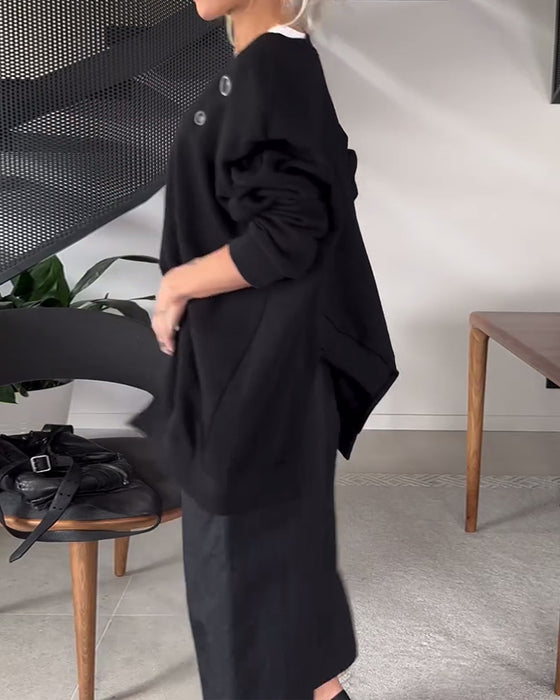 Sort sweater i løs pasform med slids