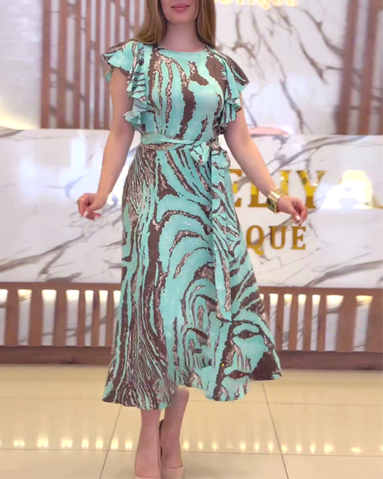 Elegant kjole med taljebånd og print