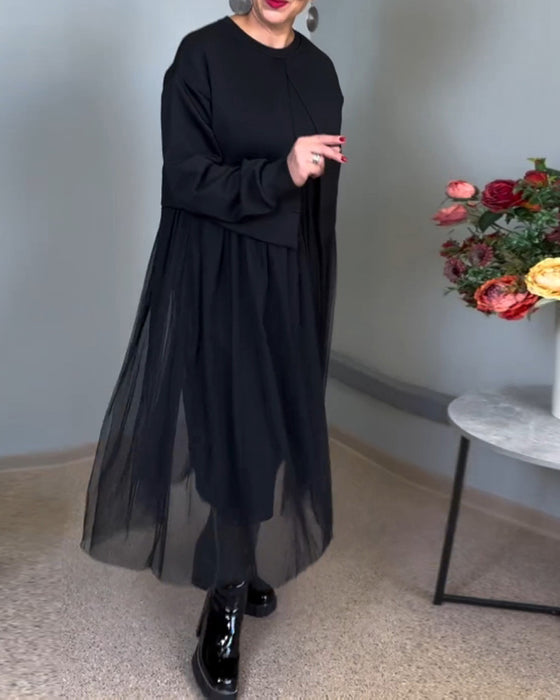 Elegant kjole med gennemsigtigt yderlag