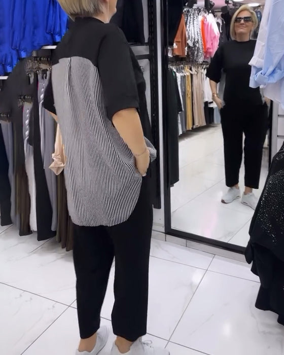 Afslappet sort bluse med nålestribet ryg