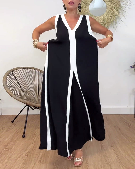 Sort kjole uden ærmer med kontrasterende hvide kanter