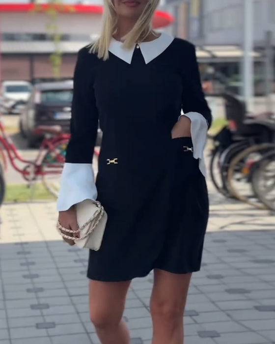 Elegant kjole med klokkeærmer og falsk lagdeling
