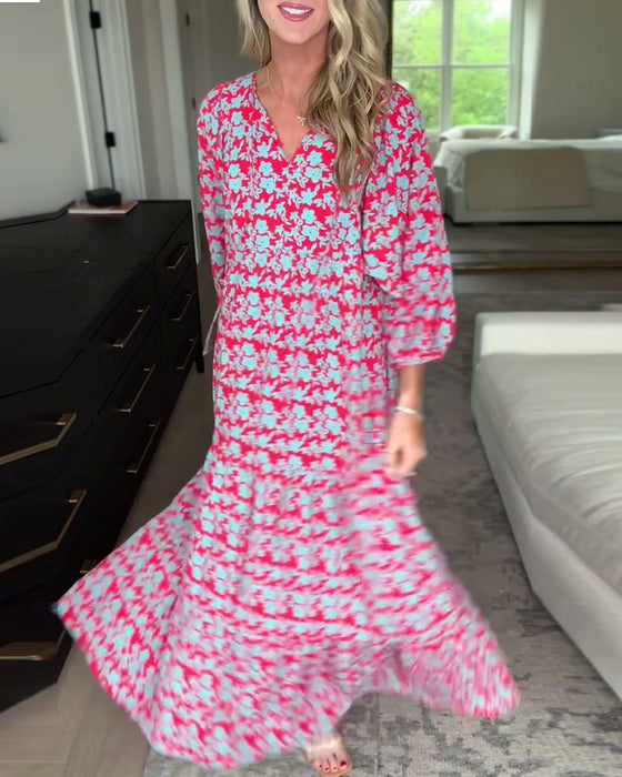 Lang blomsterkjole med V-hals og lanterneærmer