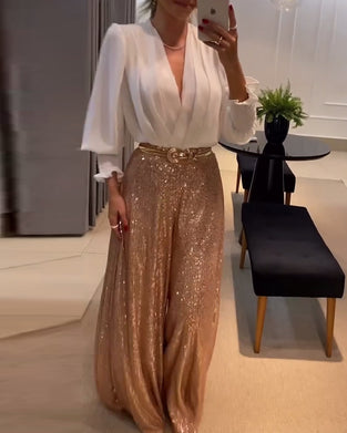 Elegant ensfarvet sommerbluse med lanterneærmer og V-udskæring