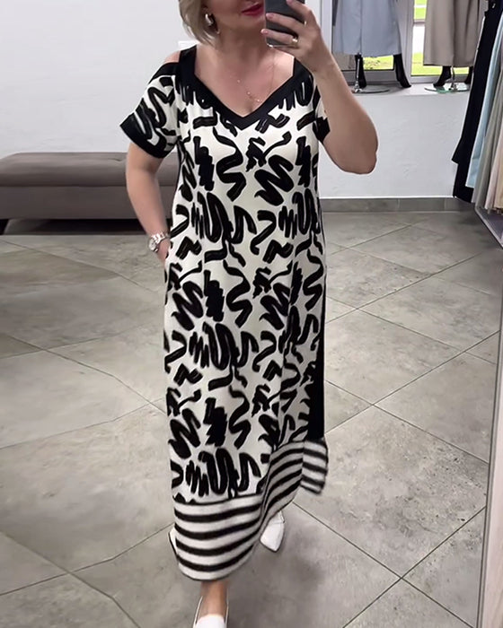 Kortærmet kjole med krusedulle print