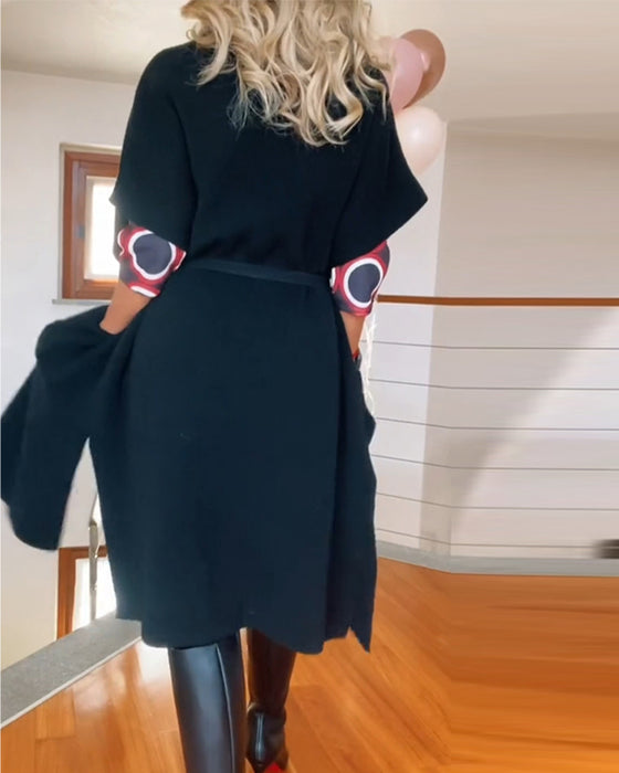 Lang sort cardigan med lommer og halve ærmer