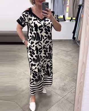 Kortærmet kjole med krusedulle print