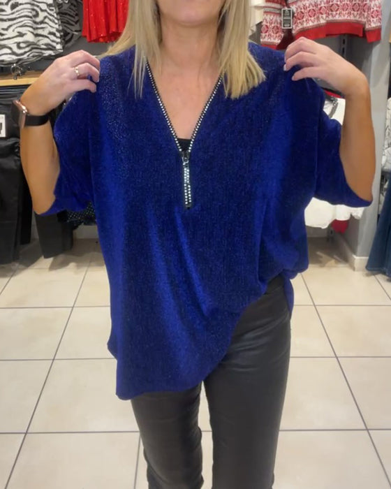 Afslappet top med lange ærmer og lynlås