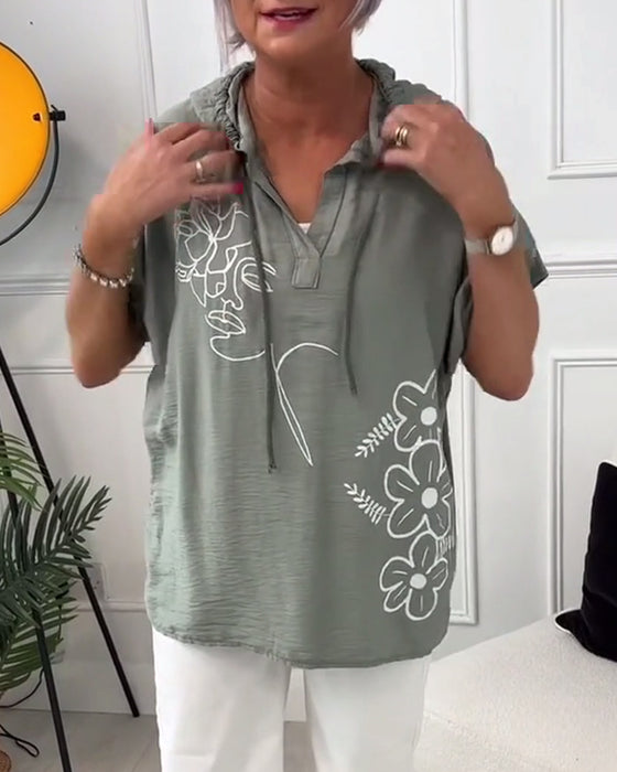 Afslappet hættetrøje med korte ærmer og blomsterprint