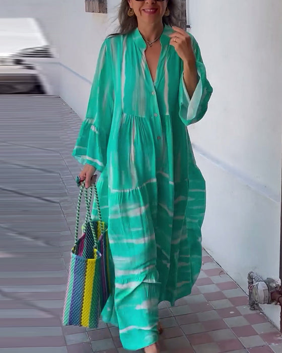 Afslappet løs lang kjole med V-udskæring og vide ærmer