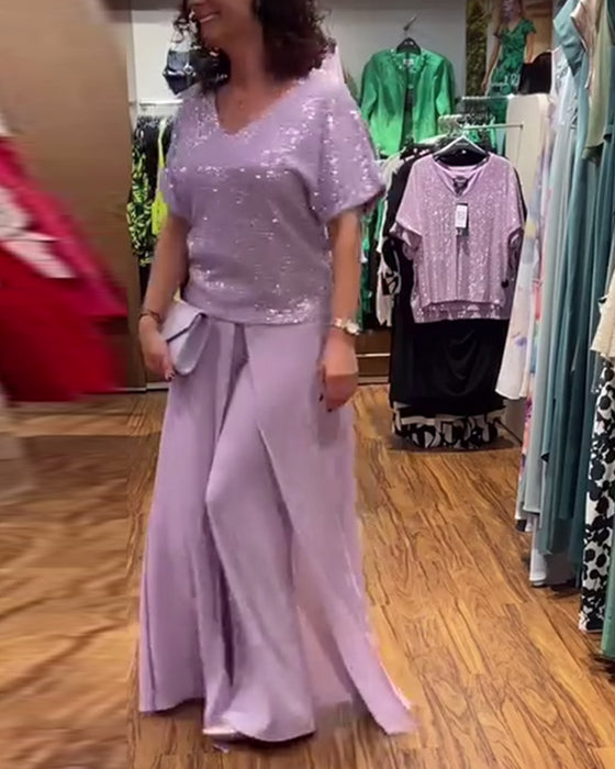 V-halset kortærmet bluse med pailletter