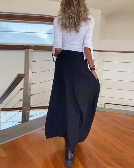 Stilfuld mørk nederdel med lynlåslommer