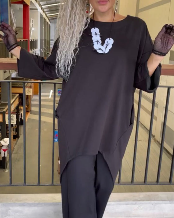 Lang top med knappelukning bagtil