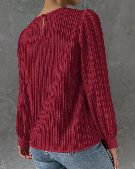 Solid bluse med lanterneærmer