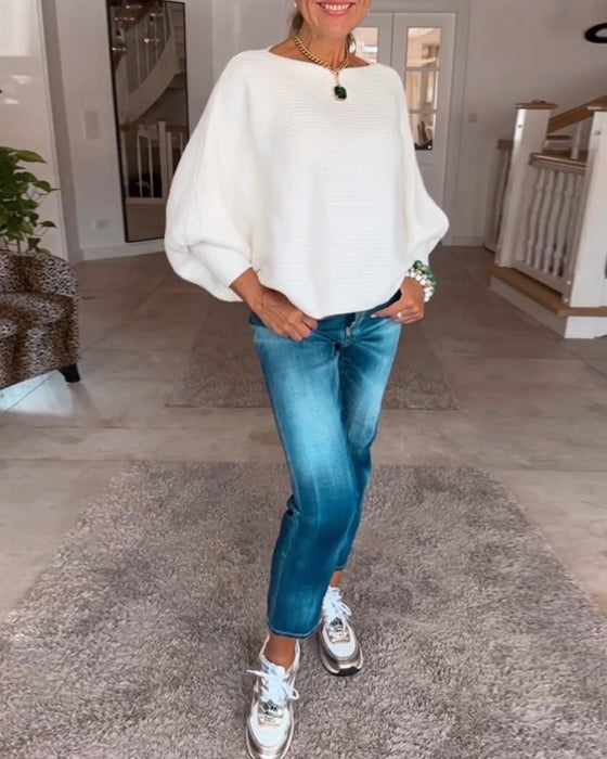 Ensfarvet sweater med lanterneærmer