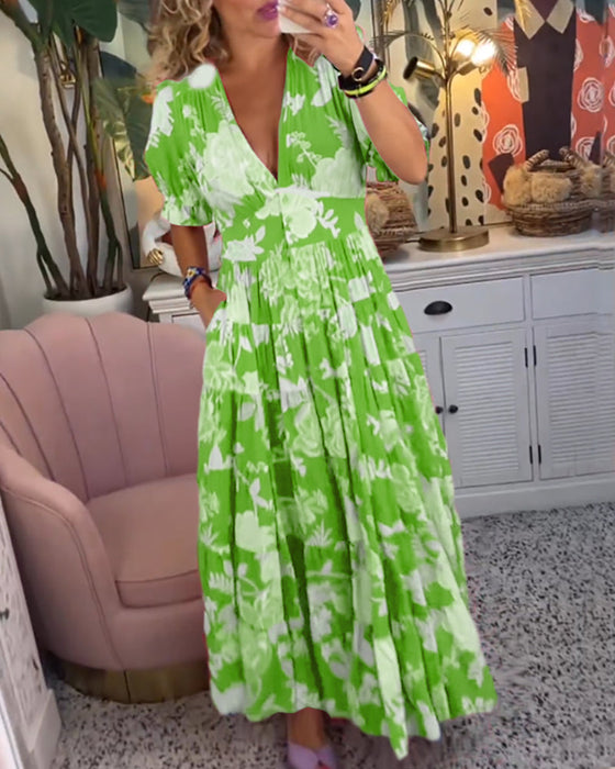 Blomsterkjole med lommer og v-udskæring