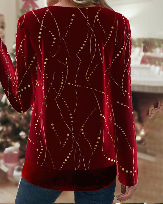 Top med gyldne accenter og bæltespændelukning