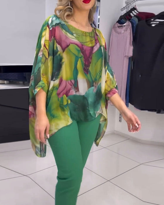 Rundhalset bluse med print og flagermusærmer