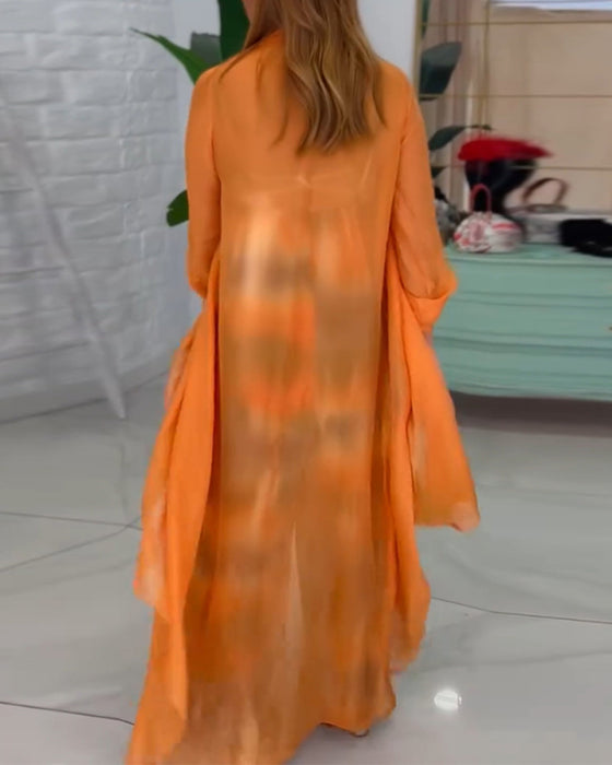 To-delt sæt | Farverigt jumpsuit og orange cardigan