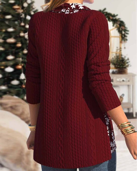 Top med snefnugtryk og kappehals