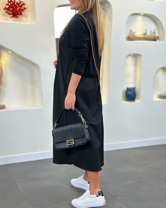 Skiftskjole med lomme og lange ærmer