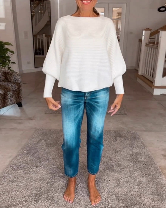 Ensfarvet sweater med lanterneærmer