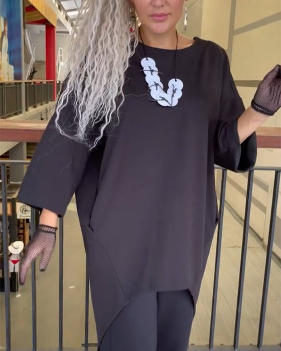 Lang top med knappelukning bagtil