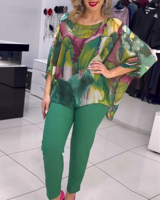 Rundhalset bluse med print og flagermusærmer