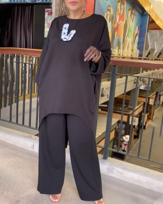 Lang top med knappelukning bagtil