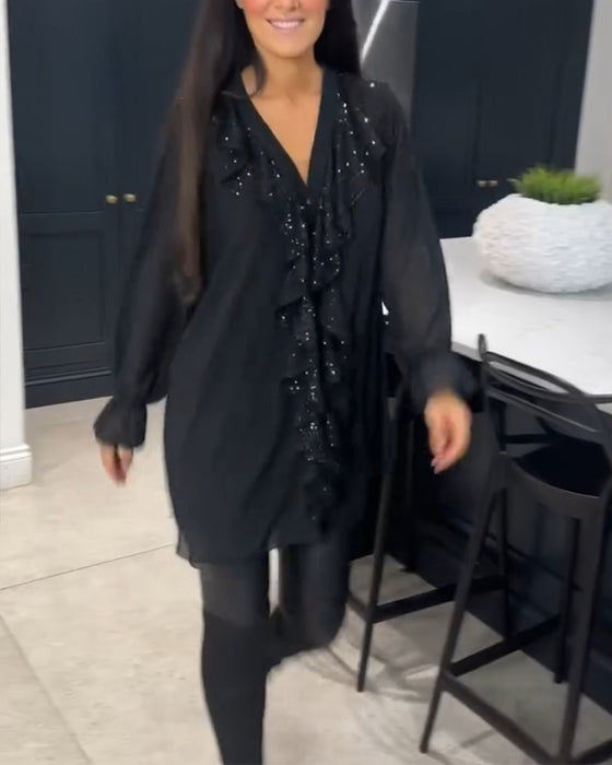 Lang bluse med elegante flæser