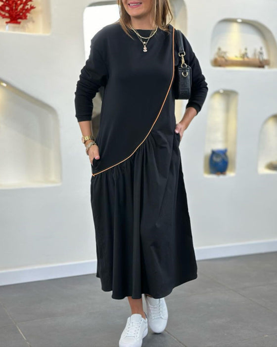 Skiftskjole med lomme og lange ærmer