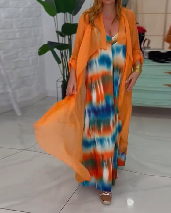 To-delt sæt | Farverigt jumpsuit og orange cardigan