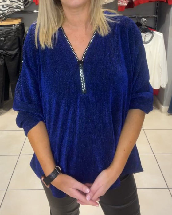 Afslappet top med lange ærmer og lynlås