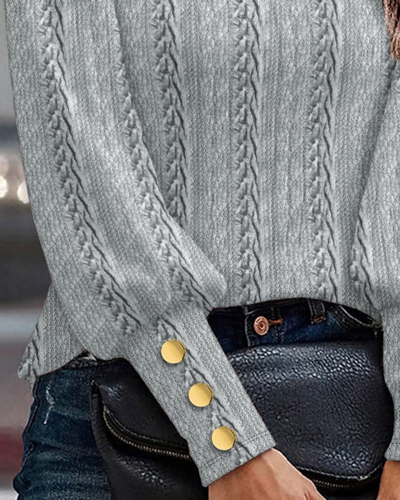 Strikmønstret bluse med manchetknapper