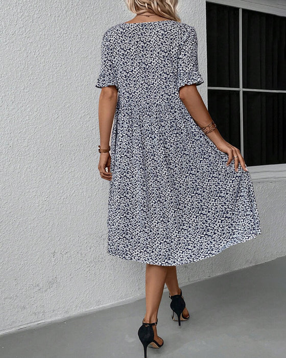 Elegant kjole med rund hals og blomsterprint