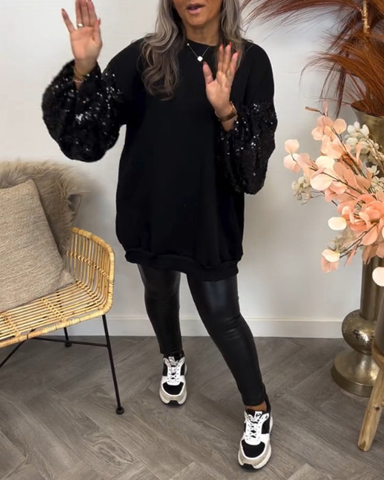 Ensfarvet sweater med vide ærmer