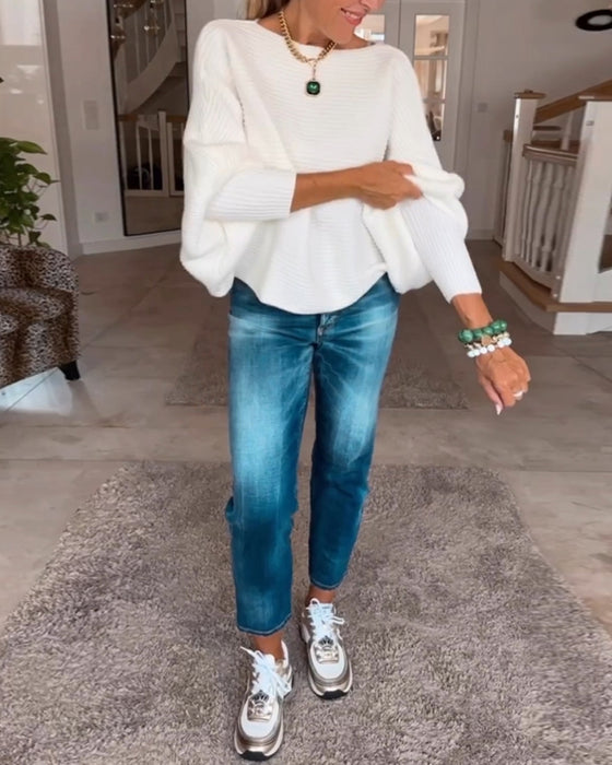 Ensfarvet sweater med lanterneærmer